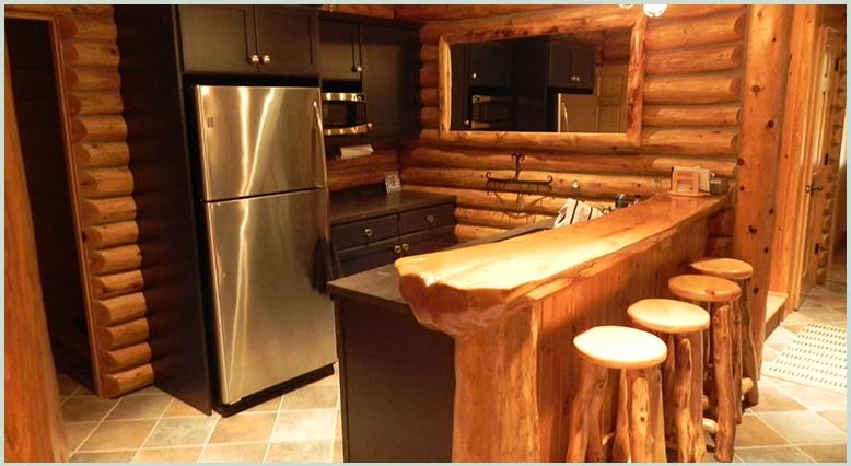 Log-walled kitchen with a live-edge bar