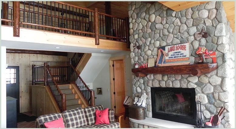 Great room with river-rock fireplace and loft